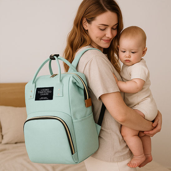 Sac a langer Nomadbag sac vert porté par maman